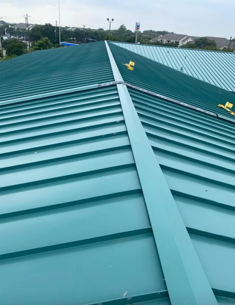 Green commercial metal roof ridge and valley for Metal Roof Repair in West Little River